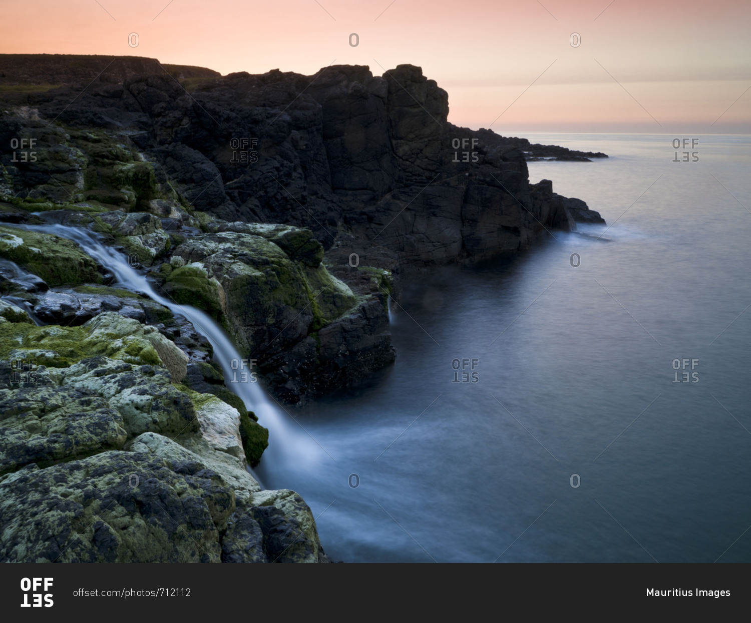 Northern Ireland, Antrim, Causeway Coast, waterfall on the coast, evening mood