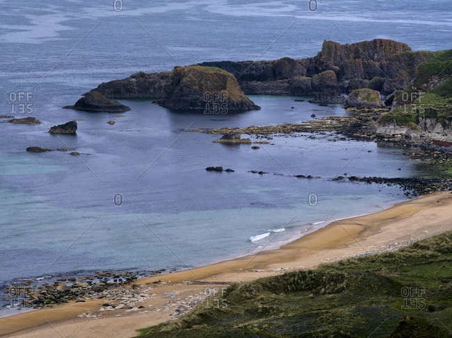 Northern Ireland, Antrim, Causeway Coast, sandy beach with basalt rock in the White park Bay