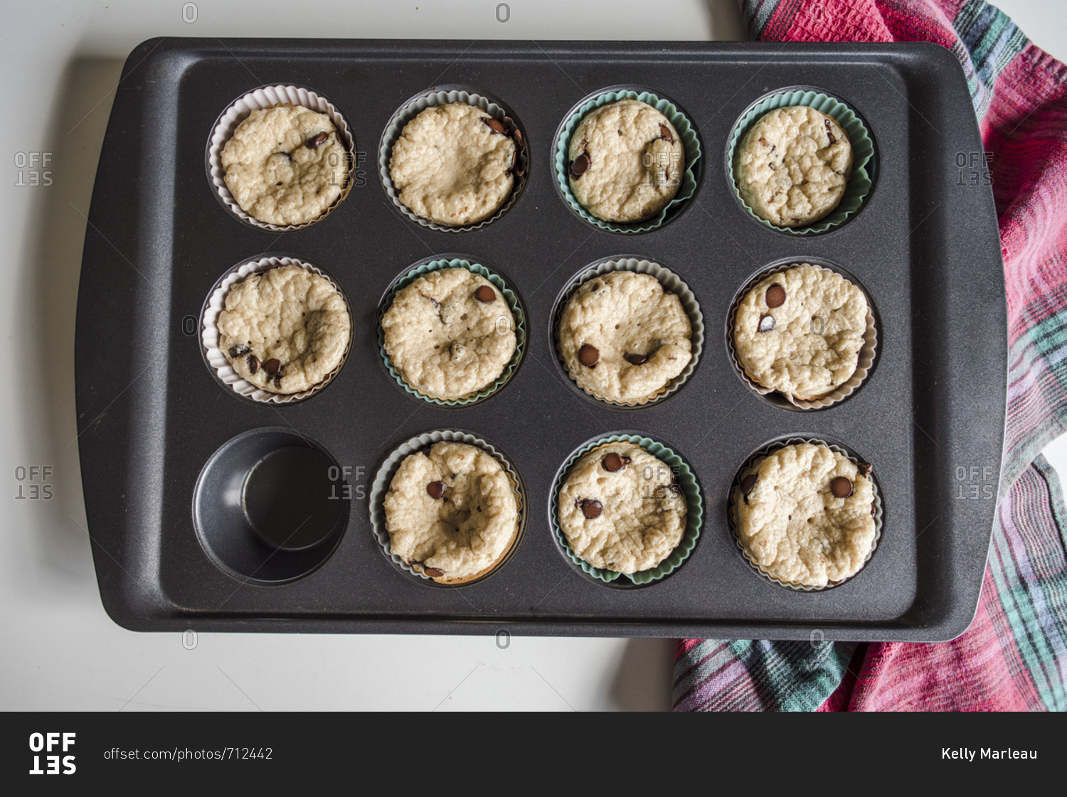 Overhead view of fresh muffins in baking tin