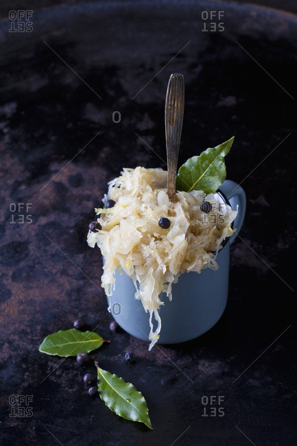 Cup of Sauerkraut with juniper berries and bay leaves