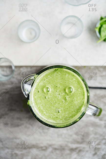 Making a healthy green smoothie in a blender