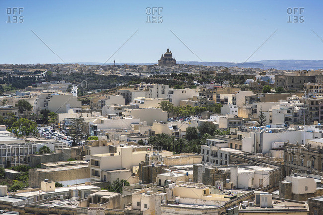 Elevated cityscape of old city with large monument in the distance