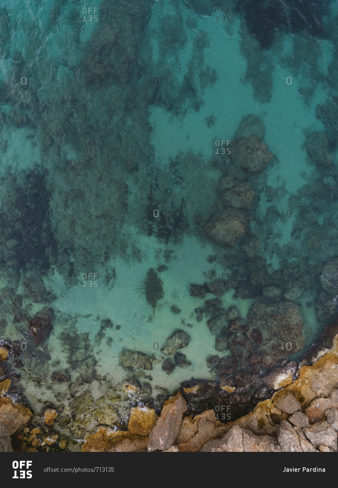 Top view of shallow Cala Vidre shoreline