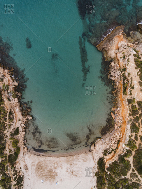 Drone view of scenic lagoon and rocky beach in Spain