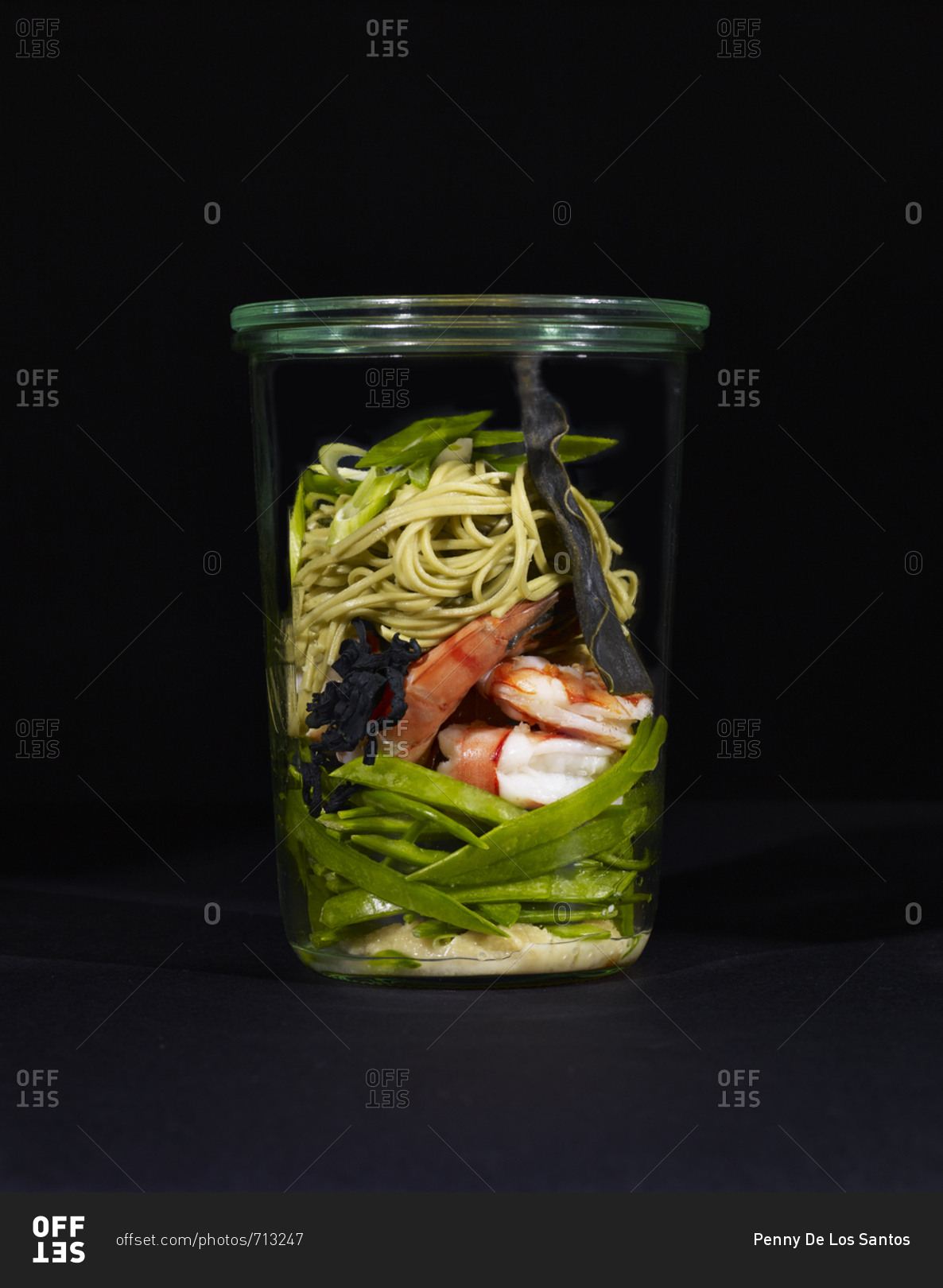 Ingredients for miso soup with shrimp, soba noodles, and green tea leaves in a cup