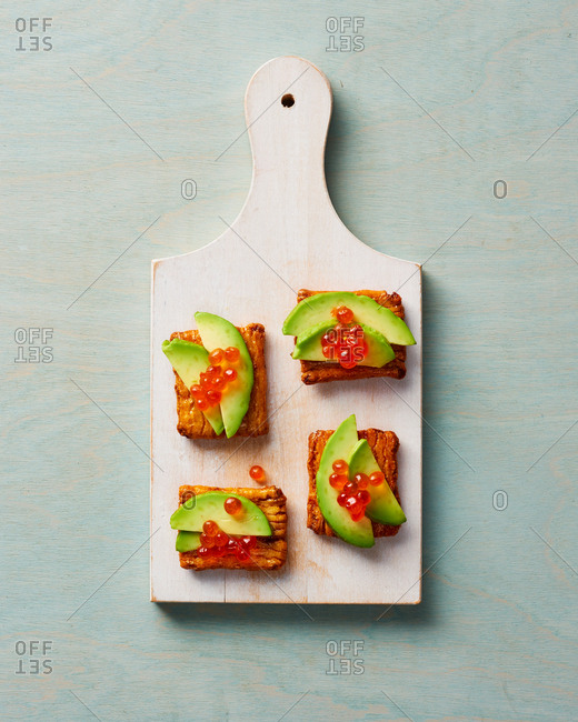 Japanese Rice Crackers with Avocado and Salmon Appetizer
