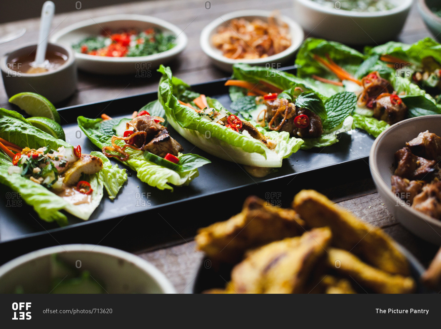 Thai lettuce cups on wood background
