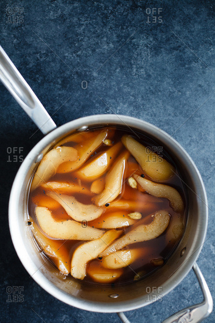 Pears in a pan on dark background