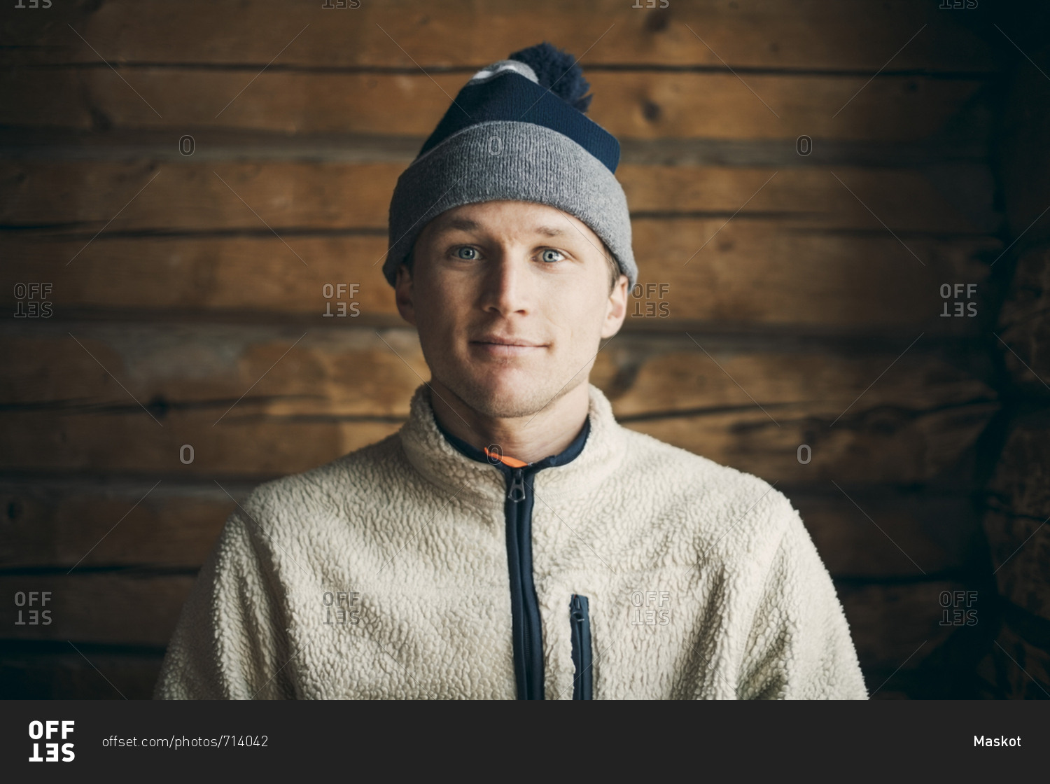 Portrait of mid adult man in log cabin