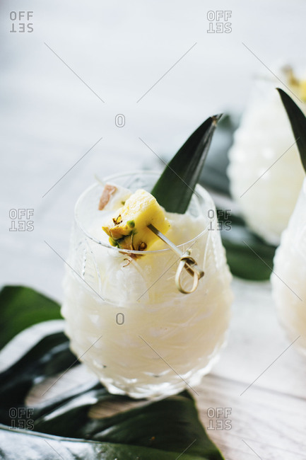 White cocktail in ornate glass
