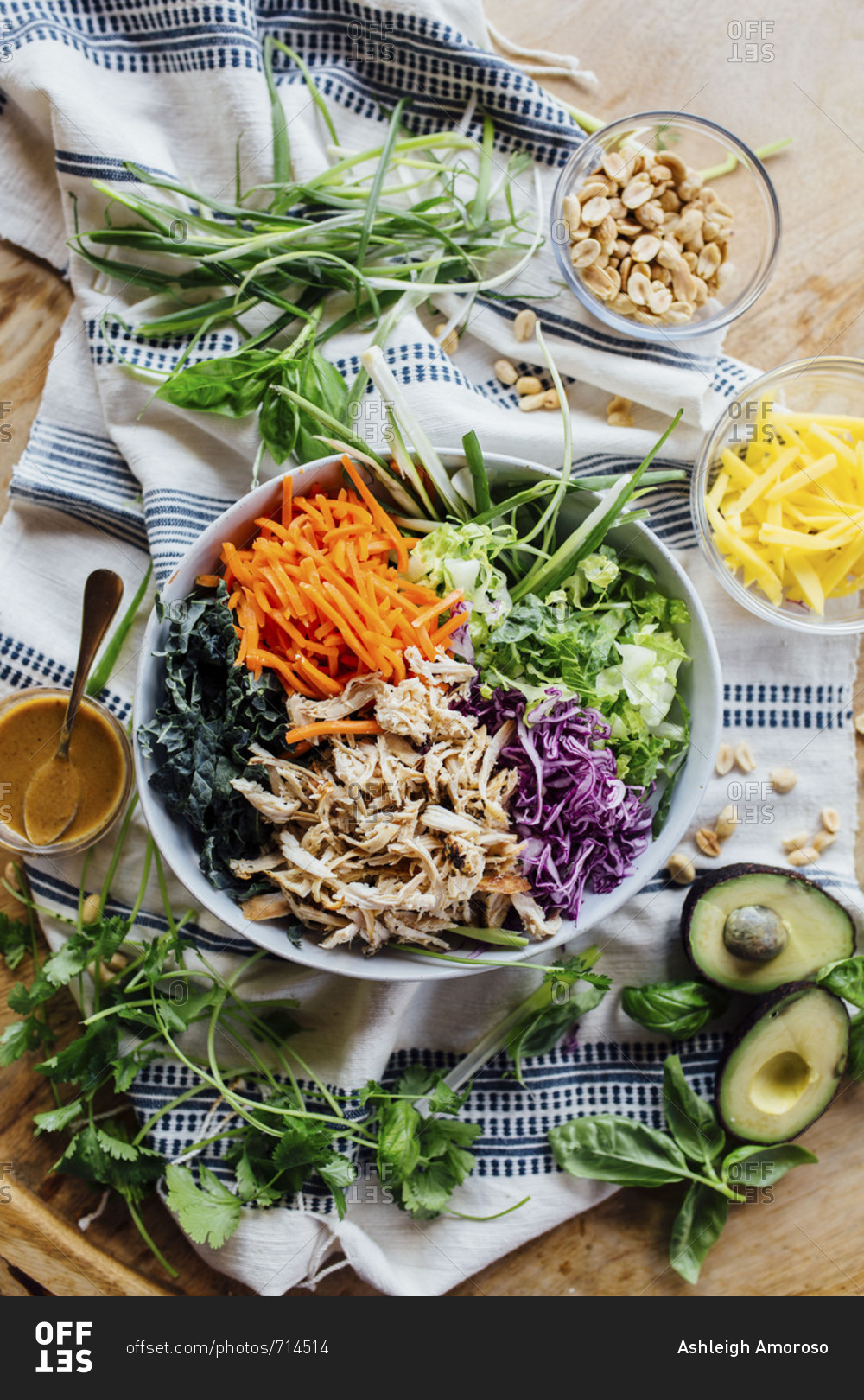 Beautiful garden salad with shredded chicken avocado and greens