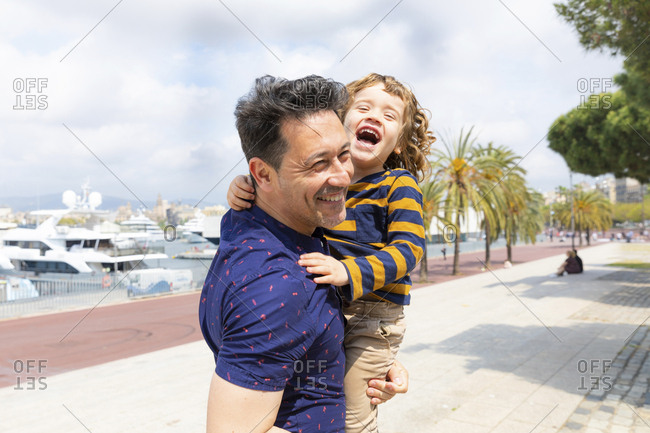 Spain- Barcelona- father and son playing together and having fun