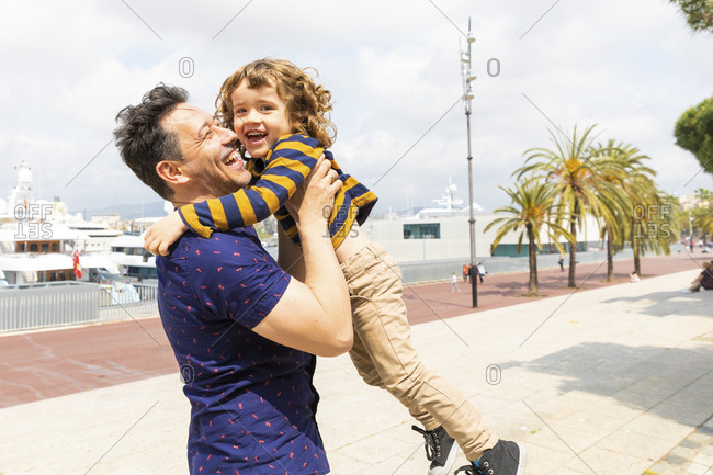 Spain- Barcelona- father and son playing together and having fun