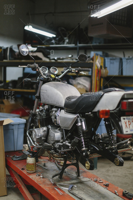 Motorcycle on table in auto repair shop