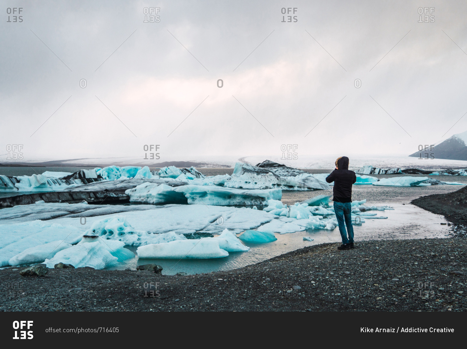 Man standing on cold sea