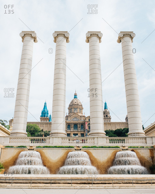 January 11, 2015: The Four Columns (Les Quatre Columnes) with Palau Nacional museum in the background, Barcelona
