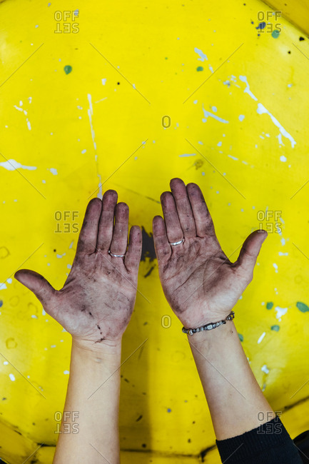 Hands stained with grease in a mechanical workshop