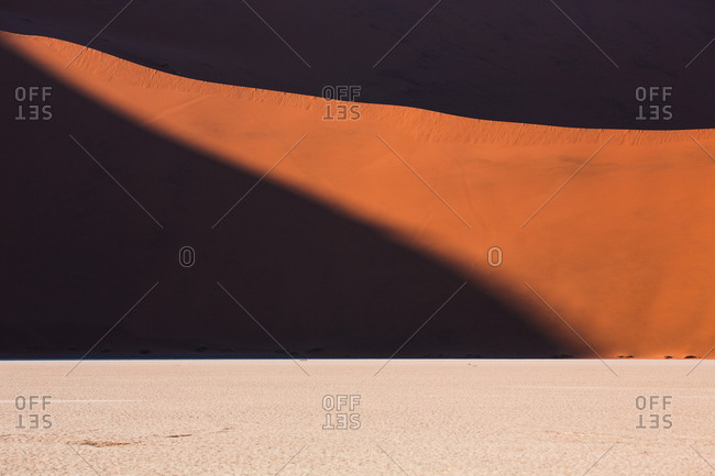Picturesque view of sand and hill in desolate desert