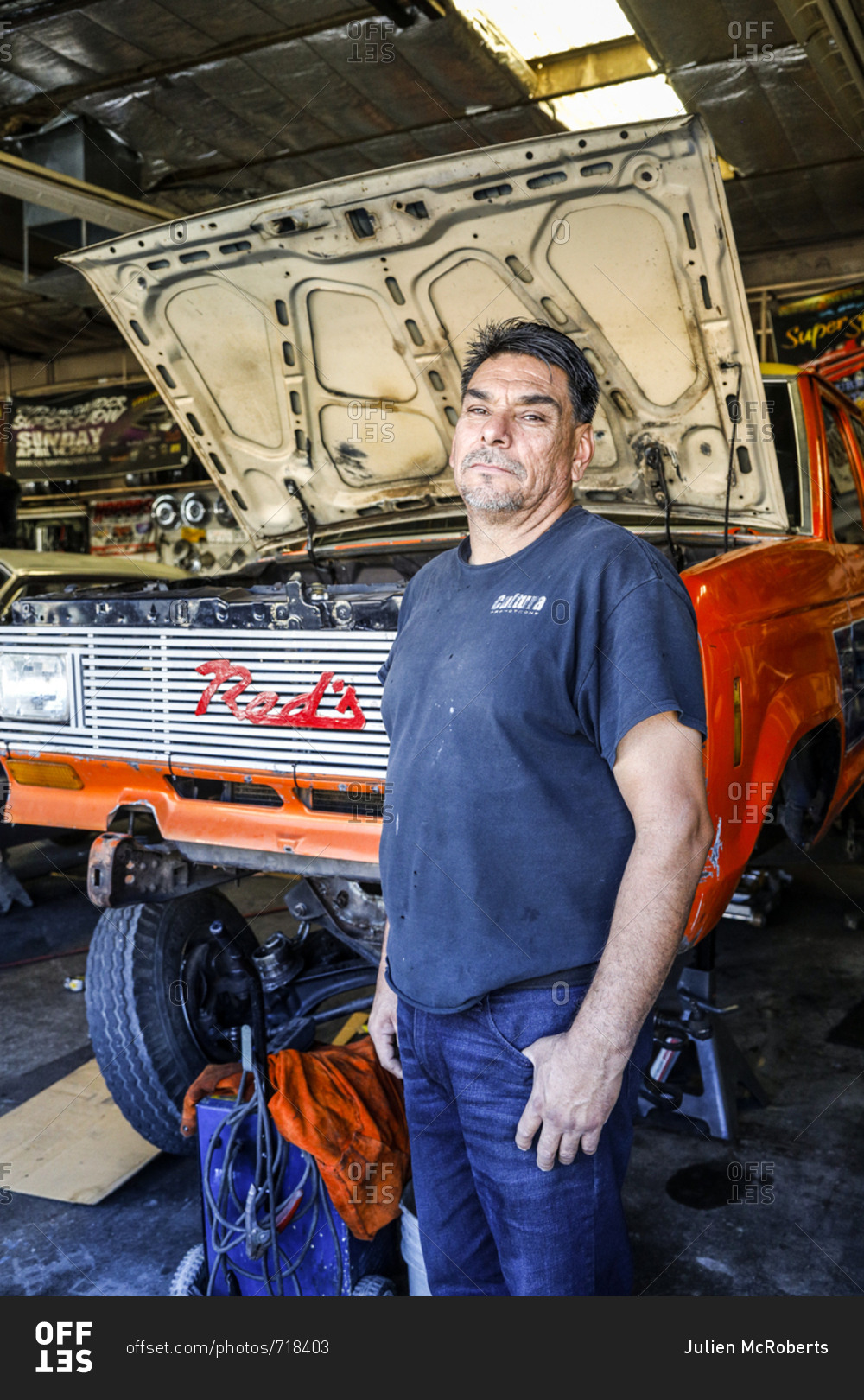 Route 66, New Mexico - June 19, 2018: Car Mechanic Posing In Garage 