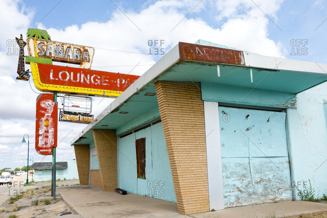 Route 66, New Mexico - June 21, 2018: Boarded up abandoned bar exterior