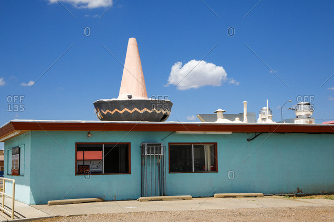 Route 66, New Mexico - June 21, 2018: Mexican restaurant with sombrero statue on roof