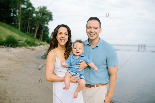 Happy family with baby on a beach
