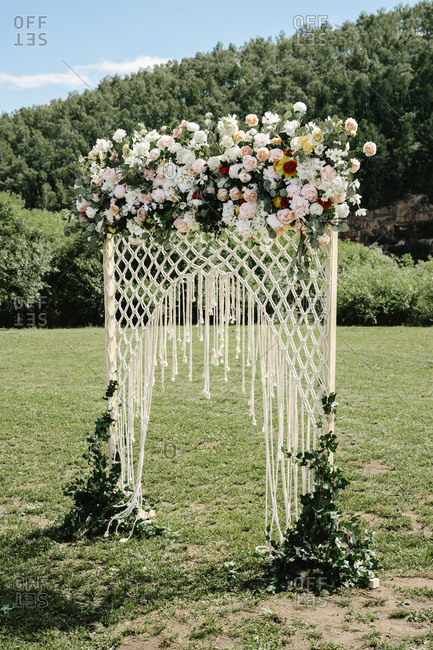 Wedding arbor with mesh net and flowers