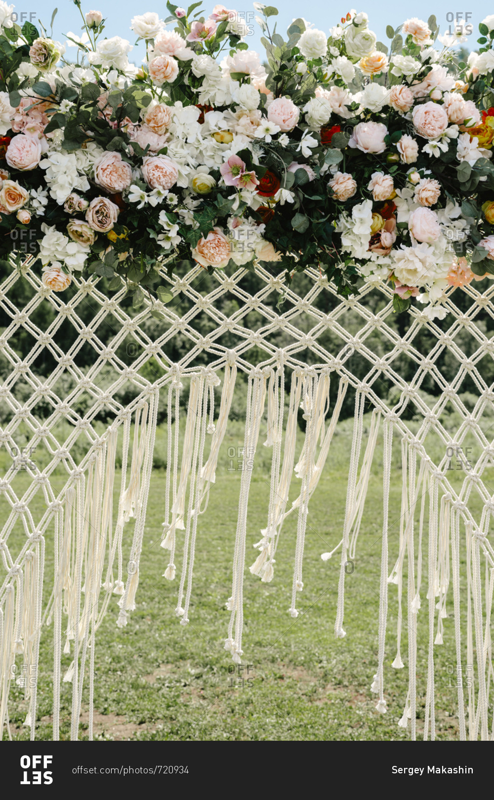 Close up of wedding arbor with mesh net and flowers