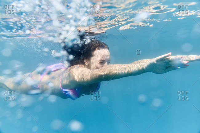 Underwater View Of Woman In Bikini Swimming Stock Photo Offset