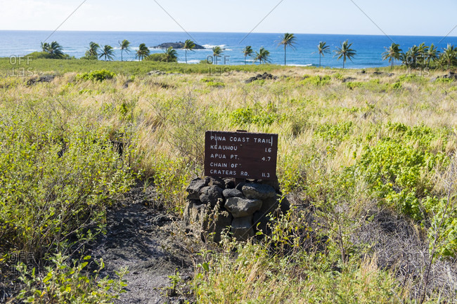 Puna Coast Trail sign along the Puna Coast Trail in Hawaii Volcanoes National Park on the Big Island of Hawaii