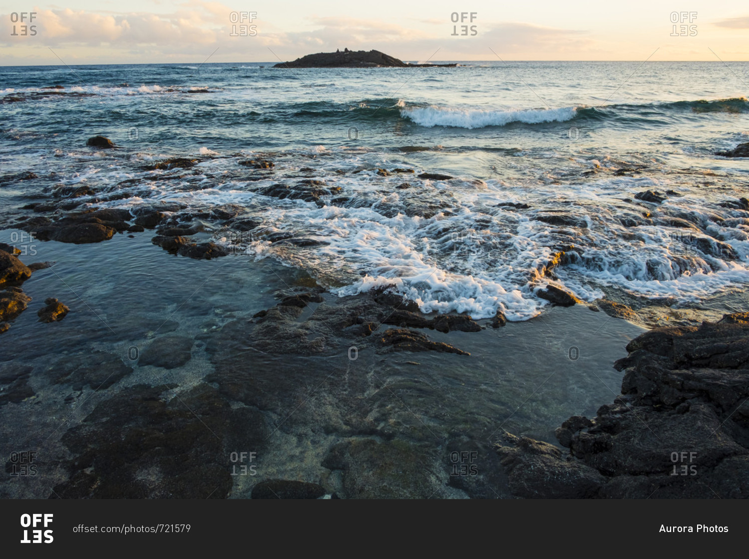 Sunset views with rocks and water from Halape Beach along the Puna