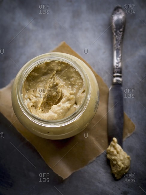 Jar of homemade chunky peanut butter.