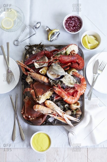 A mixed seafood platter including prawns, crab, mussels, oysters and scallops with a lemon mayonnaise