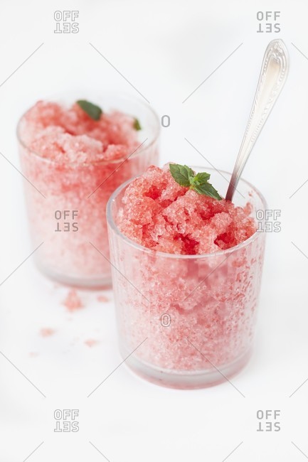 Two glasses of watermelon granita with fresh mint