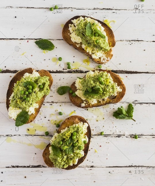 Slices of toasted bread with a pea spread