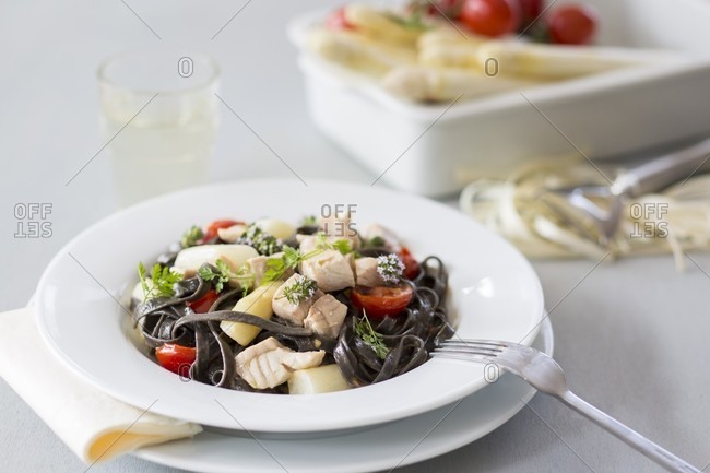 Black tagliatelle with asparagus and zander