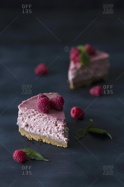Two slices of raspberry cheesecake