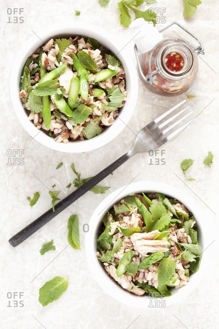 Wild rice salad with salmon, green asparagus and herbs (seen from above)