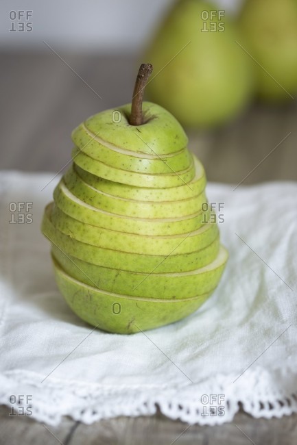 A sliced pear on cloth