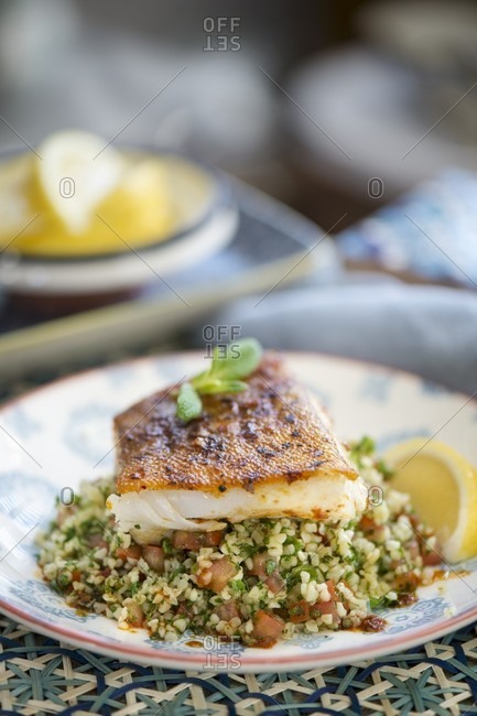Fried fish fillet on a bed of tabbouleh (Morocco)