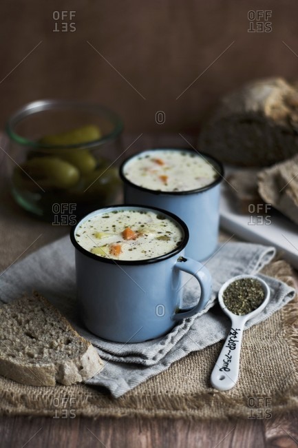 Gherkin soup in enamel mugs