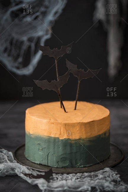 A bi-coloured Halloween cake decorated with bats