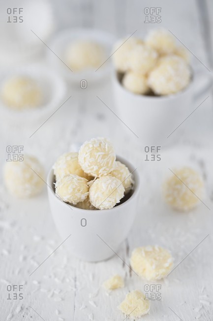 Coconut truffles in a white cup