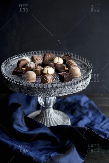 Various pralines on a vintage cake stand