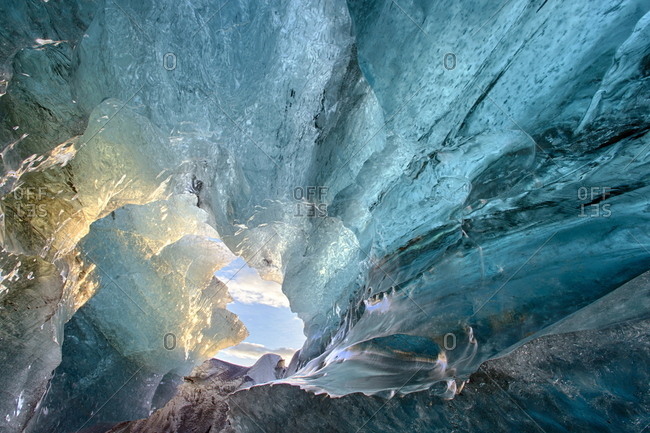View inside an ice cave under the south  Vatnajokull Glacier, captured at sunrise during winter when the ice caves are accessible, near Jokulsarlon, Southern Iceland, Iceland, Polar Regions