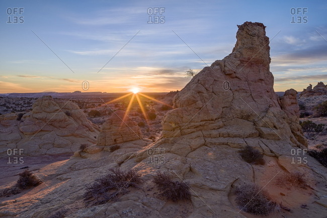 Sandstone formations at first light with a sunburst, Coyote Buttes Wilderness, Vermilion Cliffs National Monument, Arizona, United States of America, North America