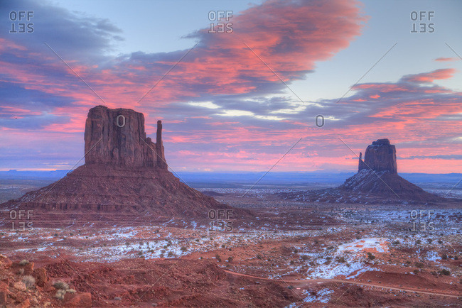 Sunrise, West Mitten Butte on left and East Mitten Butte on right, Monument Valley Navajo Tribal Park, Utah, United States of America, North America