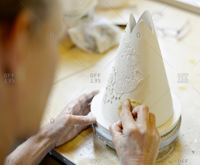 Close-up of woman working in porcelain workshop