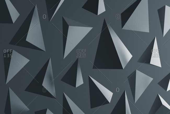 Grey pyramids in front of grey background