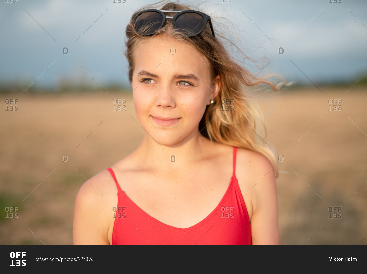 Lexica - Young blonde woman with square sunglasses wearing an open